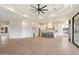 Open concept kitchen with white cabinets and hardwood floors at 10606 N Indian Wells Dr, Fountain Hills, AZ 85268