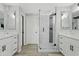 Elegant bathroom with double vanity, marble shower, and modern fixtures at 13021 N 41St Pl, Phoenix, AZ 85032