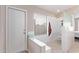 Walk-in shower with bench seating and grab bars at 13450 W Maui Ln, Surprise, AZ 85379