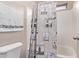 Bathroom with shower/tub combo and lighthouse shower curtain at 13450 W Maui Ln, Surprise, AZ 85379
