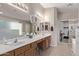 Bathroom boasts dual sinks, and an adjacent walk-in closet at 13450 W Maui Ln, Surprise, AZ 85379