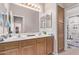 Bathroom with double vanity and large mirror at 13450 W Maui Ln, Surprise, AZ 85379