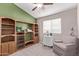Cozy bedroom with built-in shelving and comfortable armchair at 13450 W Maui Ln, Surprise, AZ 85379