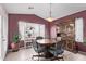 Quaint dining area with a round table and hutch at 13450 W Maui Ln, Surprise, AZ 85379