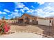 House exterior view, showcasing backyard and landscaping at 13450 W Maui Ln, Surprise, AZ 85379