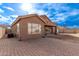 House exterior showing backyard patio and landscaping at 13450 W Maui Ln, Surprise, AZ 85379