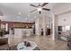 Open kitchen with a breakfast bar and wooden cabinets at 13450 W Maui Ln, Surprise, AZ 85379