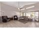 Spacious living room featuring a neutral color scheme and comfy seating at 13450 W Maui Ln, Surprise, AZ 85379