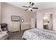 Main bedroom with large dresser and en-suite bathroom access at 13450 W Maui Ln, Surprise, AZ 85379