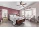 Main bedroom with bay window seating area and ceiling fan at 13450 W Maui Ln, Surprise, AZ 85379