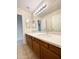 Bathroom boasts double vanity with quartz countertop at 13622 W Peck Ct, Litchfield Park, AZ 85340