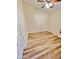 Bright bedroom with wood-look flooring and ceiling fan at 13622 W Peck Ct, Litchfield Park, AZ 85340