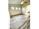 Spacious bedroom with wood-look floors and en-suite bathroom access at 13622 W Peck Ct, Litchfield Park, AZ 85340