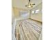 Large bedroom with wood-look floors and ceiling fan at 13622 W Peck Ct, Litchfield Park, AZ 85340
