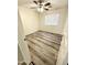 Well-lit bedroom with wood-look vinyl flooring at 13622 W Peck Ct, Litchfield Park, AZ 85340