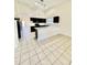Modern kitchen with dark cabinets and quartz countertops at 13622 W Peck Ct, Litchfield Park, AZ 85340