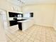 Well-lit kitchen with an open layout, modern appliances, and ample countertop space at 13622 W Peck Ct, Litchfield Park, AZ 85340