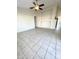 Bright living room with tile floors and built-in shelving at 13622 W Peck Ct, Litchfield Park, AZ 85340