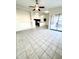 Open living area with tile floors, kitchen views, and patio access at 13622 W Peck Ct, Litchfield Park, AZ 85340