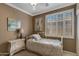 Cozy bedroom with a daybed, dresser, and window shutters at 141 W Roadrunner Dr, Chandler, AZ 85286