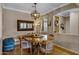 Dining room with wood table and globe chandelier at 141 W Roadrunner Dr, Chandler, AZ 85286