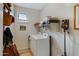 Laundry room with washer, dryer, and shelving at 141 W Roadrunner Dr, Chandler, AZ 85286