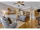 Spacious living room with hardwood floors and artwork at 141 W Roadrunner Dr, Chandler, AZ 85286