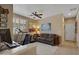 Home office with a treadmill, desk, and comfortable seating at 141 W Roadrunner Dr, Chandler, AZ 85286