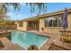 Inviting backyard pool with brick patio and seating at 141 W Roadrunner Dr, Chandler, AZ 85286