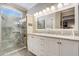 Elegant bathroom featuring a double vanity and a large walk-in shower at 14205 W Via Montoya Dr, Sun City West, AZ 85375