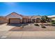 Single-story home with a two-car garage and desert landscaping at 14205 W Via Montoya Dr, Sun City West, AZ 85375