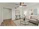 Living room features hardwood floors, neutral decor, and a ceiling fan at 1510 E Edgewood Ave, Mesa, AZ 85204