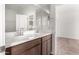 Modern bathroom with double vanity, and a bathtub at 16744 W Cavedale Dr, Surprise, AZ 85387