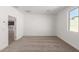 Bright bedroom with carpet flooring and an open door at 16744 W Cavedale Dr, Surprise, AZ 85387