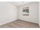 Simple bedroom with neutral walls, carpet, and a window at 16744 W Cavedale Dr, Surprise, AZ 85387