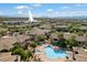 Scenic aerial view of the community showcasing pools, lush landscaping, and fountain in the background at 16800 E El Lago Blvd # 2020, Fountain Hills, AZ 85268