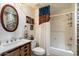 Bathroom with unique stone accent wall, modern fixtures, and a shower-tub combo at 16800 E El Lago Blvd # 2020, Fountain Hills, AZ 85268