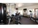 Well-equipped gym featuring modern exercise machines, free weights, and a wall-mounted television at 16800 E El Lago Blvd # 2020, Fountain Hills, AZ 85268