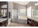 Main bathroom with soaking tub, shower, and double vanity at 17815 N 81St Way, Scottsdale, AZ 85255