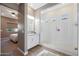 Elegant bathroom with a large walk-in shower, granite countertop, and white cabinetry at 19886 W Glenrosa Ave, Litchfield Park, AZ 85340