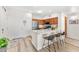 Kitchen entry with island, three barstools, and white quartz countertop at 20100 N 78Th Pl # 3088, Scottsdale, AZ 85255