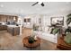 Open concept kitchen and living area with hardwood floors and island at 20596 N 226Th Dr, Surprise, AZ 85387
