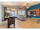 Open concept living and dining area with tile flooring and neutral colors at 20768 W Hamilton St, Buckeye, AZ 85396