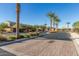 Gated community entrance with palm trees and brick pavers at 2931 E Citrus Way, Chandler, AZ 85286