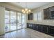 Bright dining area with patio access and modern chandelier at 2931 E Citrus Way, Chandler, AZ 85286