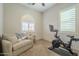Home gym with Peloton bike and comfortable seating at 2931 E Citrus Way, Chandler, AZ 85286