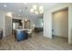 Open concept kitchen with island and view to living room at 2931 E Citrus Way, Chandler, AZ 85286