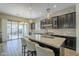 Modern kitchen with dark cabinetry, granite counters and island at 2931 E Citrus Way, Chandler, AZ 85286