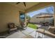 Relaxing covered patio with seating area and artificial turf at 2931 E Citrus Way, Chandler, AZ 85286