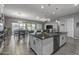 Spacious kitchen with island, stainless steel appliances, and white cabinetry at 3171 W San Cristobal Rd, San Tan Valley, AZ 85144